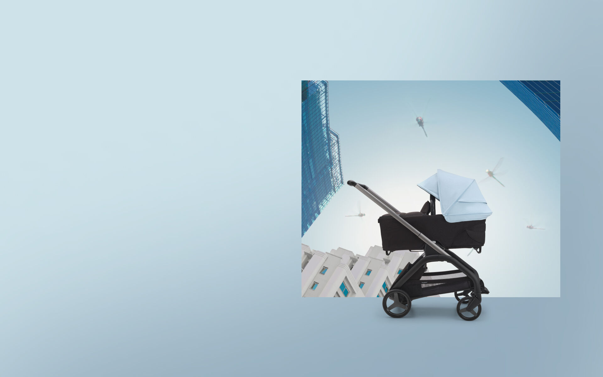 Bugaboo Dragonfly stroller with bassinet and Skyline blue sun canopy.